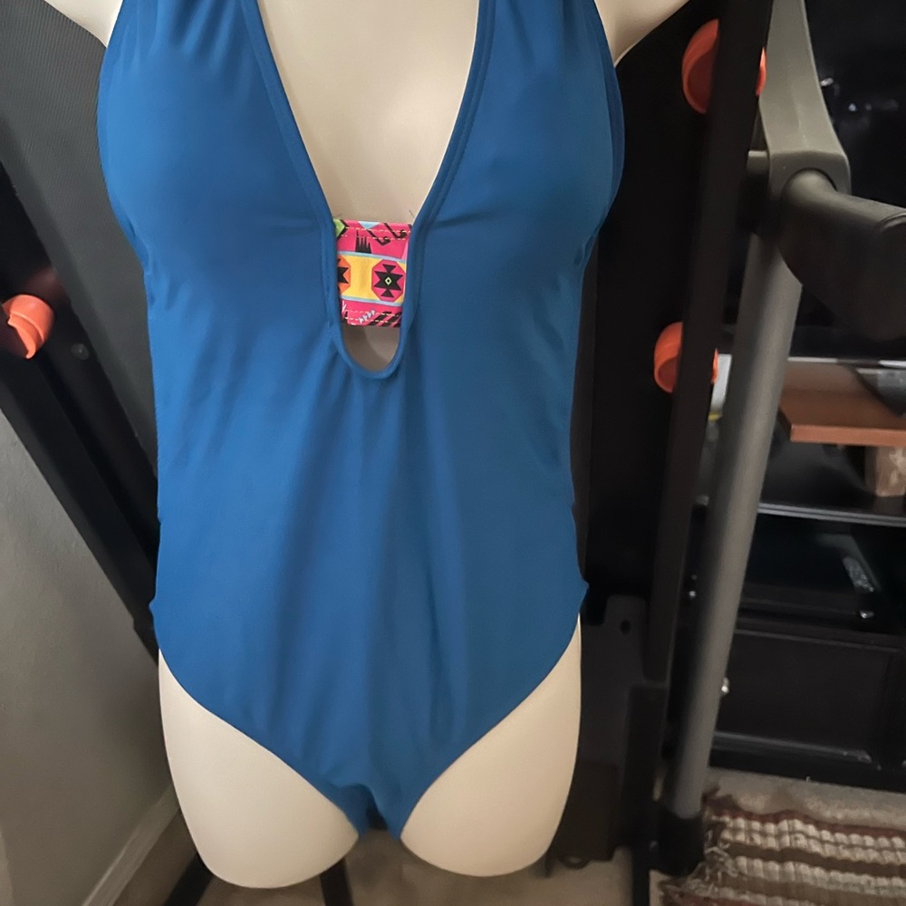 Womens high cut one piece bathing suit. L